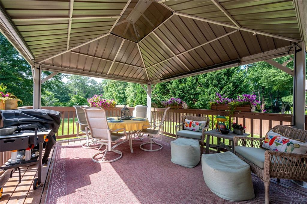 4205 Jeri Lynn Court Tucker, GA 30084 - Photo 30 of 34 a patio with a patio table and chairs