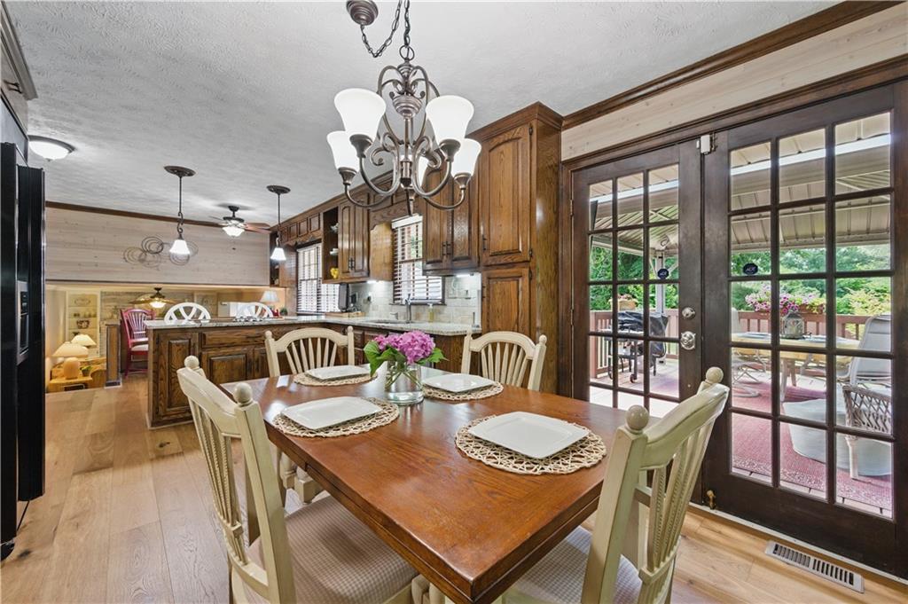4205 Jeri Lynn Court Tucker, GA 30084 - Photo 8 of 34 a dining room with furniture a chandelier and window