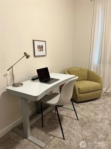 a living room with a couch and a window