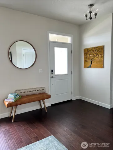 a bench sitting in a room next to a window
