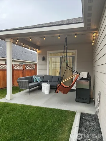 a living room with furniture and a rug