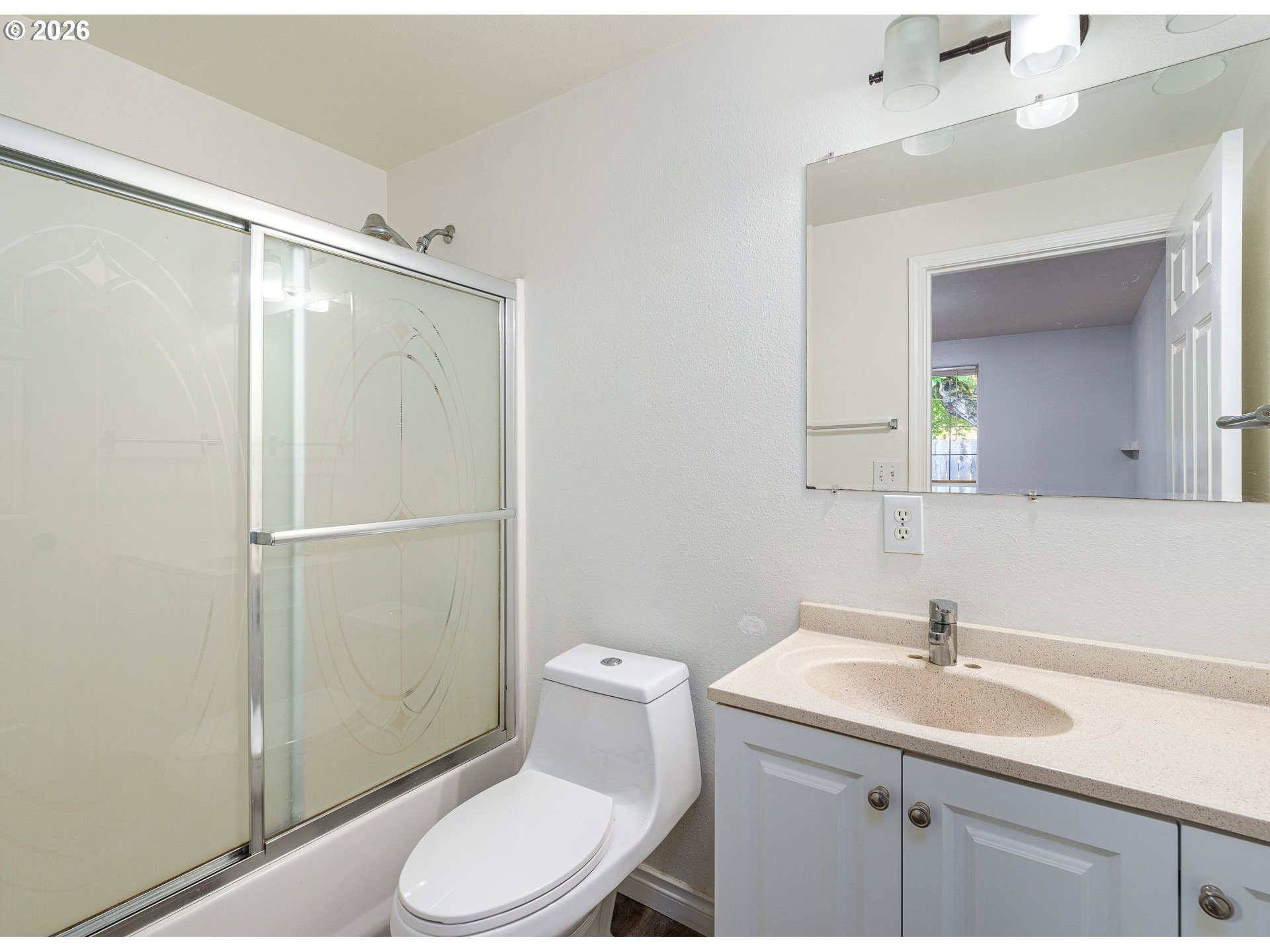 15310 Southeast Stark Street Portland, OR 97233 - Photo 11 of 18 a bathroom with a sink toilet and vanity