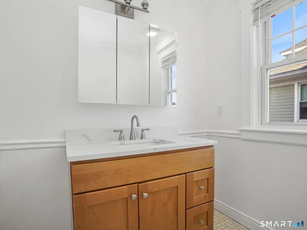 a bathroom with a sink and a cabinets