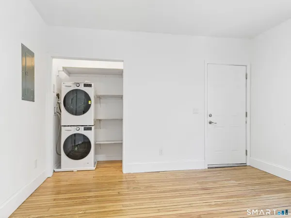a view of a kitchen with a washer and dryer