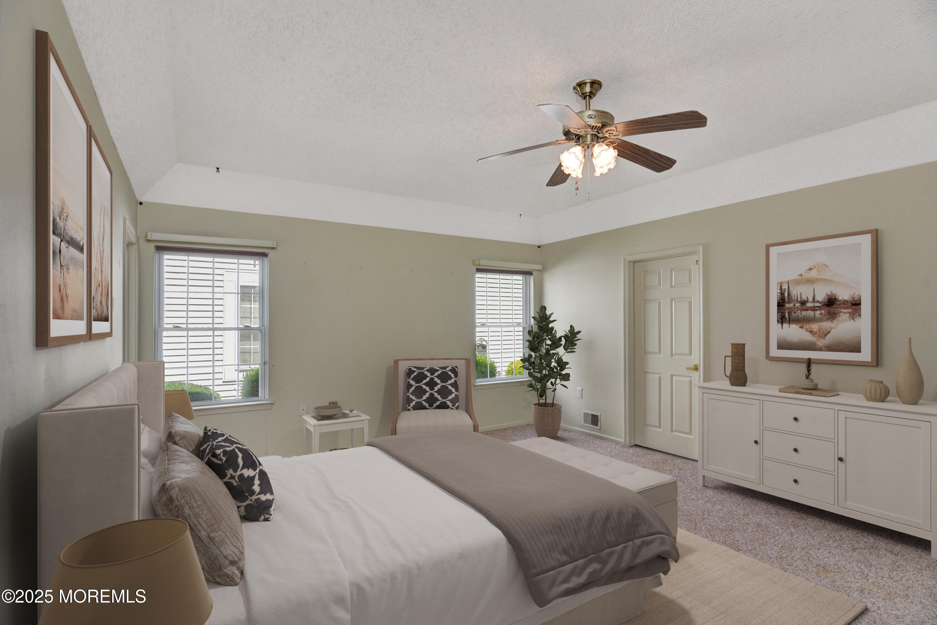 58 Spyglass Drive Jackson, NJ 08527 - Photo 11 of 32 a bedroom with a bed and a chandelier