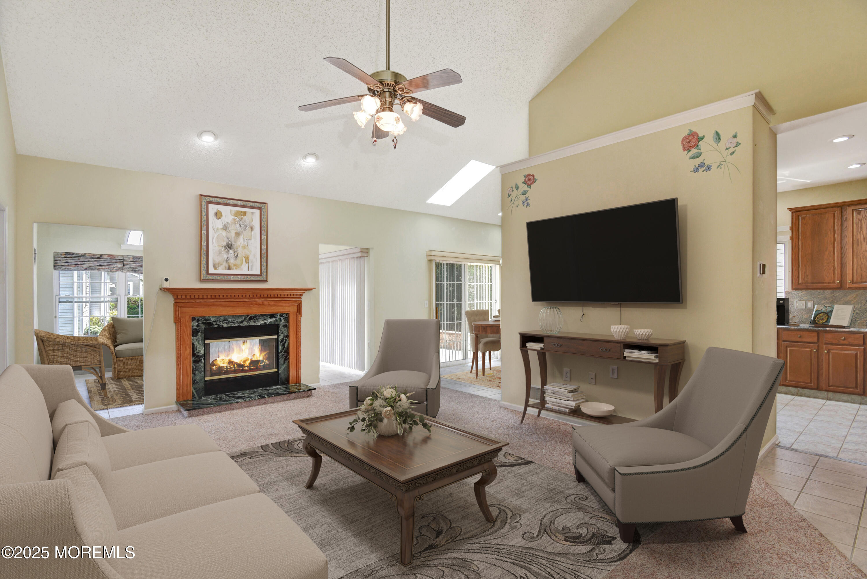 58 Spyglass Drive Jackson, NJ 08527 - Photo 6 of 32 a living room with furniture a fireplace and a flat screen tv