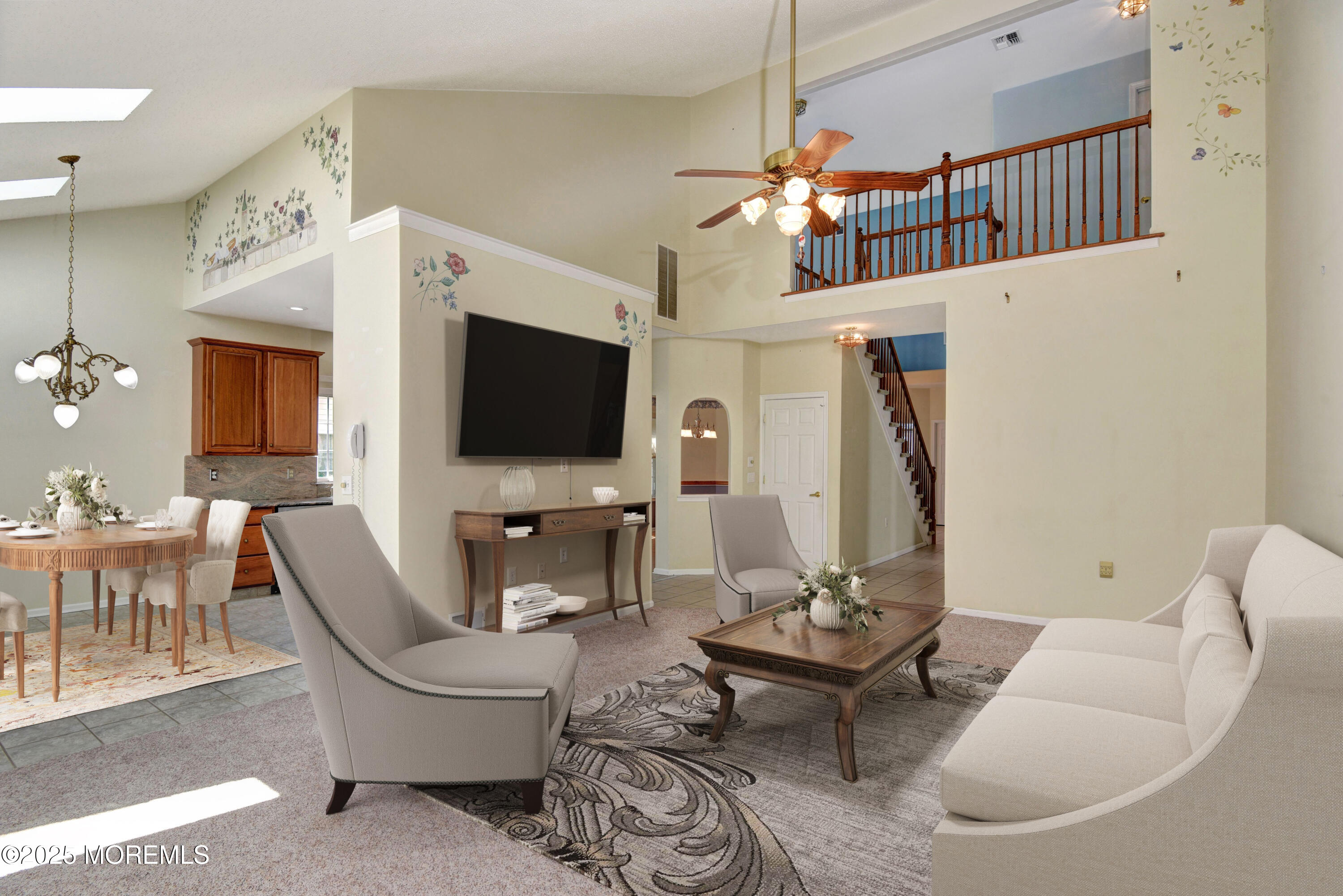 58 Spyglass Drive Jackson, NJ 08527 - Photo 7 of 32 a living room with furniture a flat screen tv and a dining table