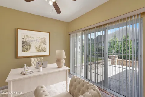 a view of a bedroom with furniture and windows