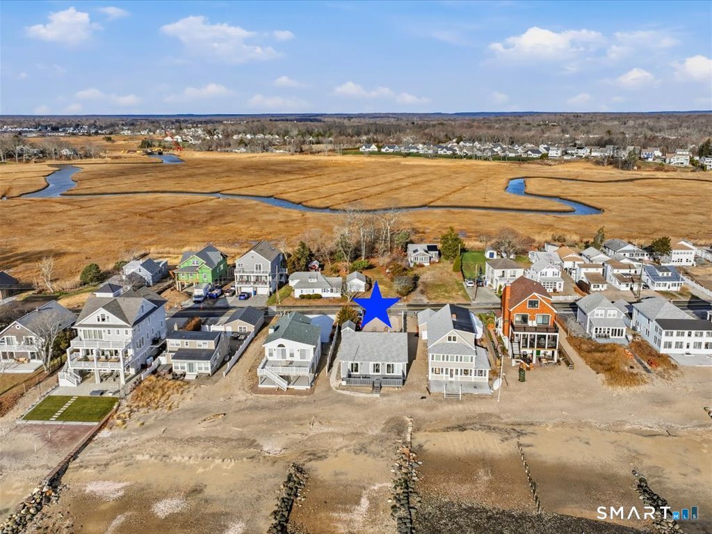 75 Shore Road Clinton, CT 06413 - Photo 37 of 40 a view of an ocean and a building