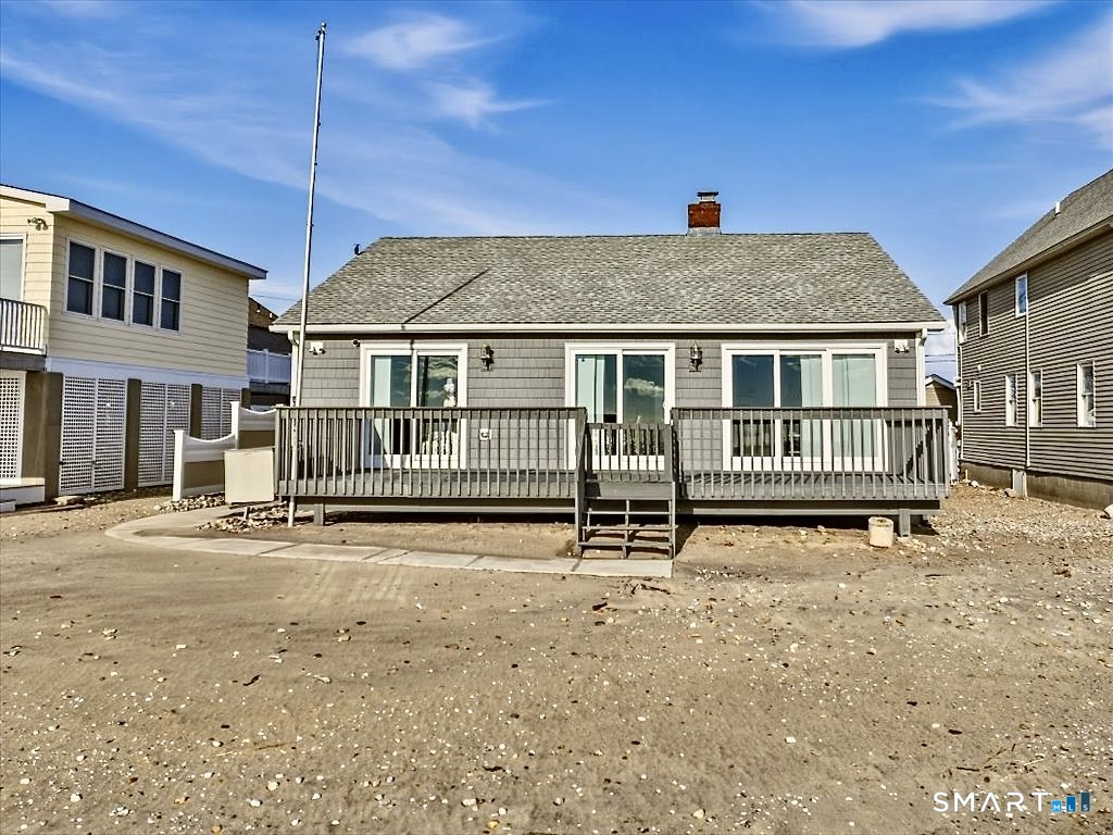 75 Shore Road Clinton, CT 06413 - Photo 39 of 40 a front view of a house with a yard