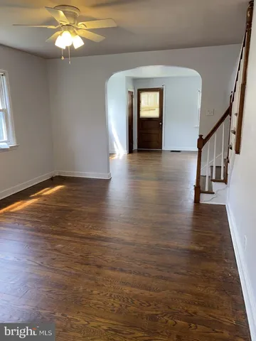 a view of livingroom with hardwood floor and hallway