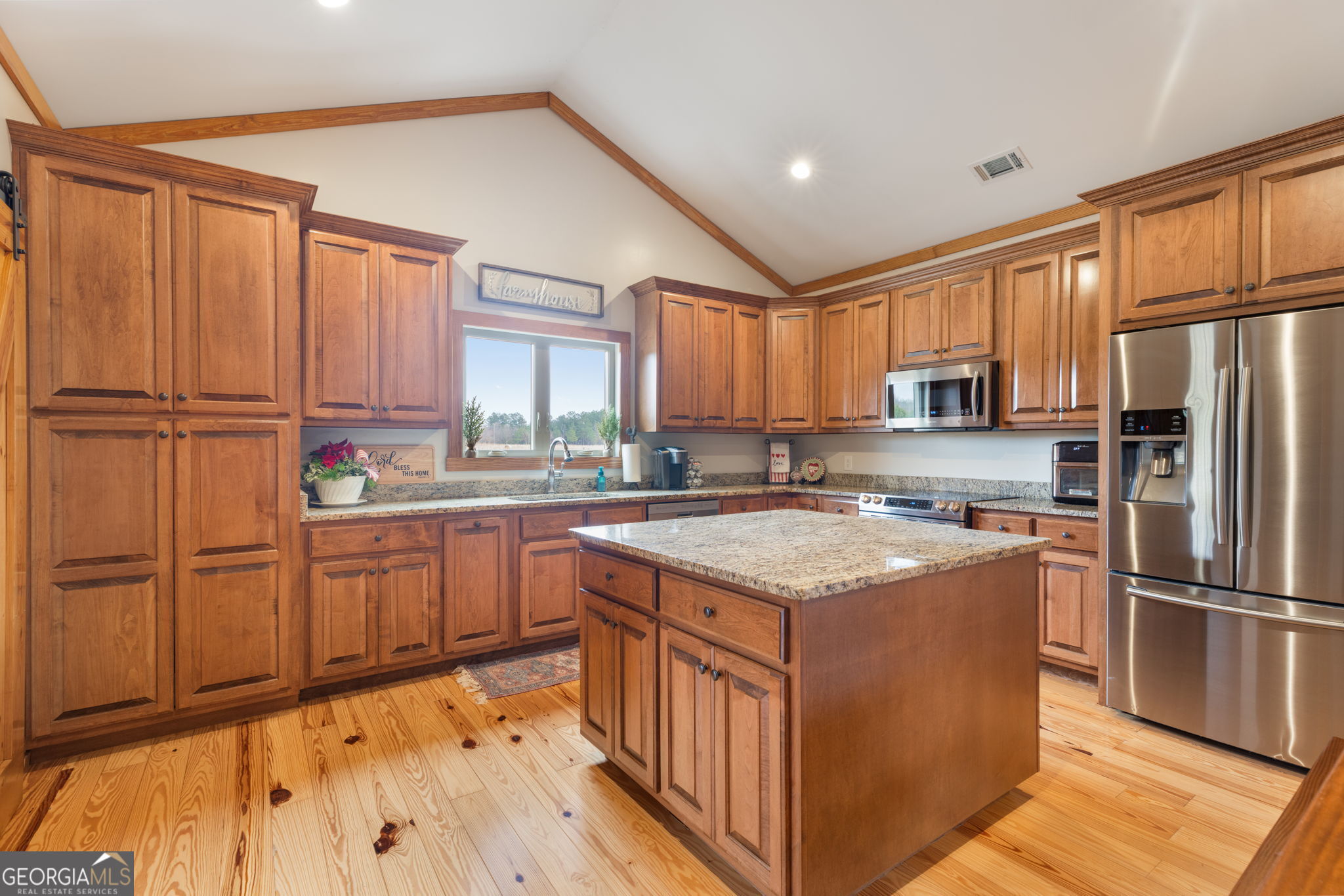 2770 Jones Road Sandersville, GA 31082 - Photo 16 of 80 a kitchen with stainless steel appliances granite countertop a refrigerator sink and cabinets