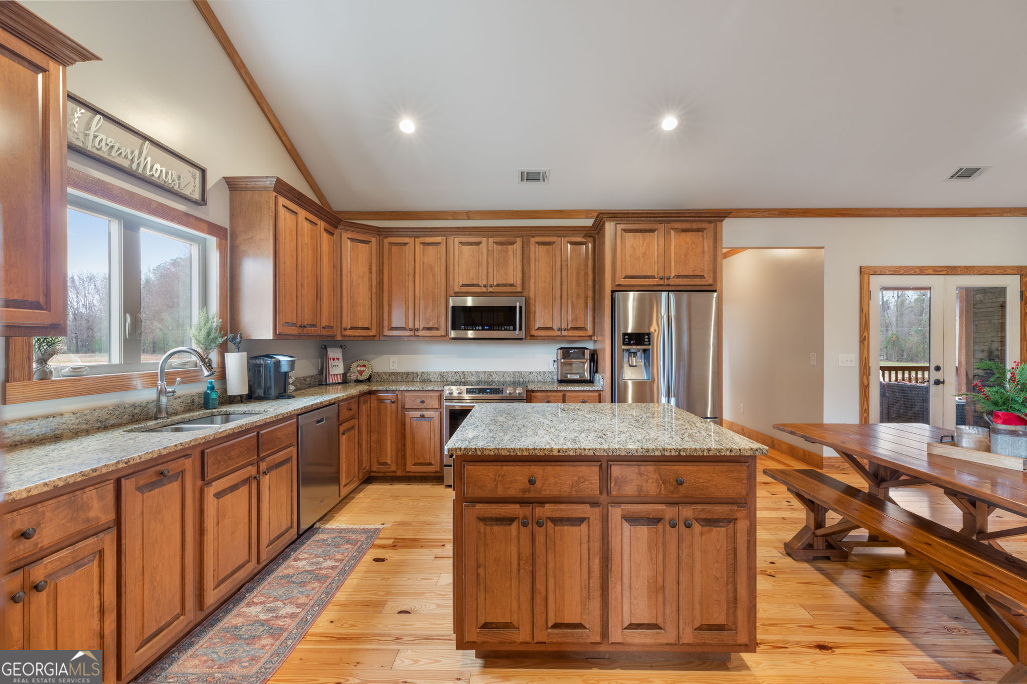 2770 Jones Road Sandersville, GA 31082 - Photo 18 of 80 a kitchen with stainless steel appliances granite countertop a sink stove and refrigerator