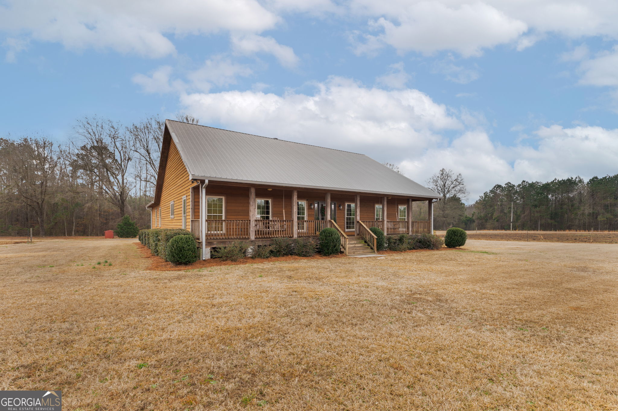 2770 Jones Road Sandersville, GA 31082 - Photo 2 of 80 a front view of a house with a yard