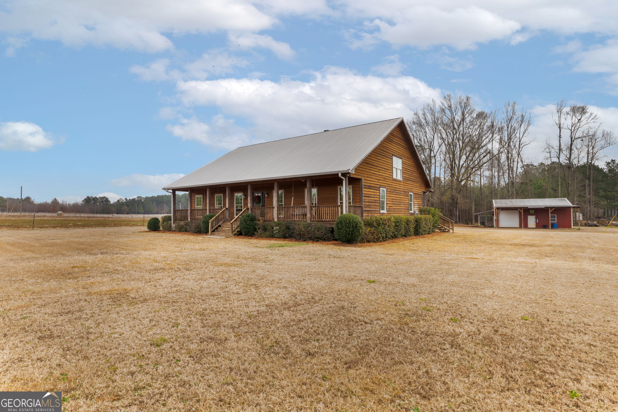2770 Jones Road Sandersville, GA 31082 - Photo 3 of 80 a front view of a house with a yard and garage