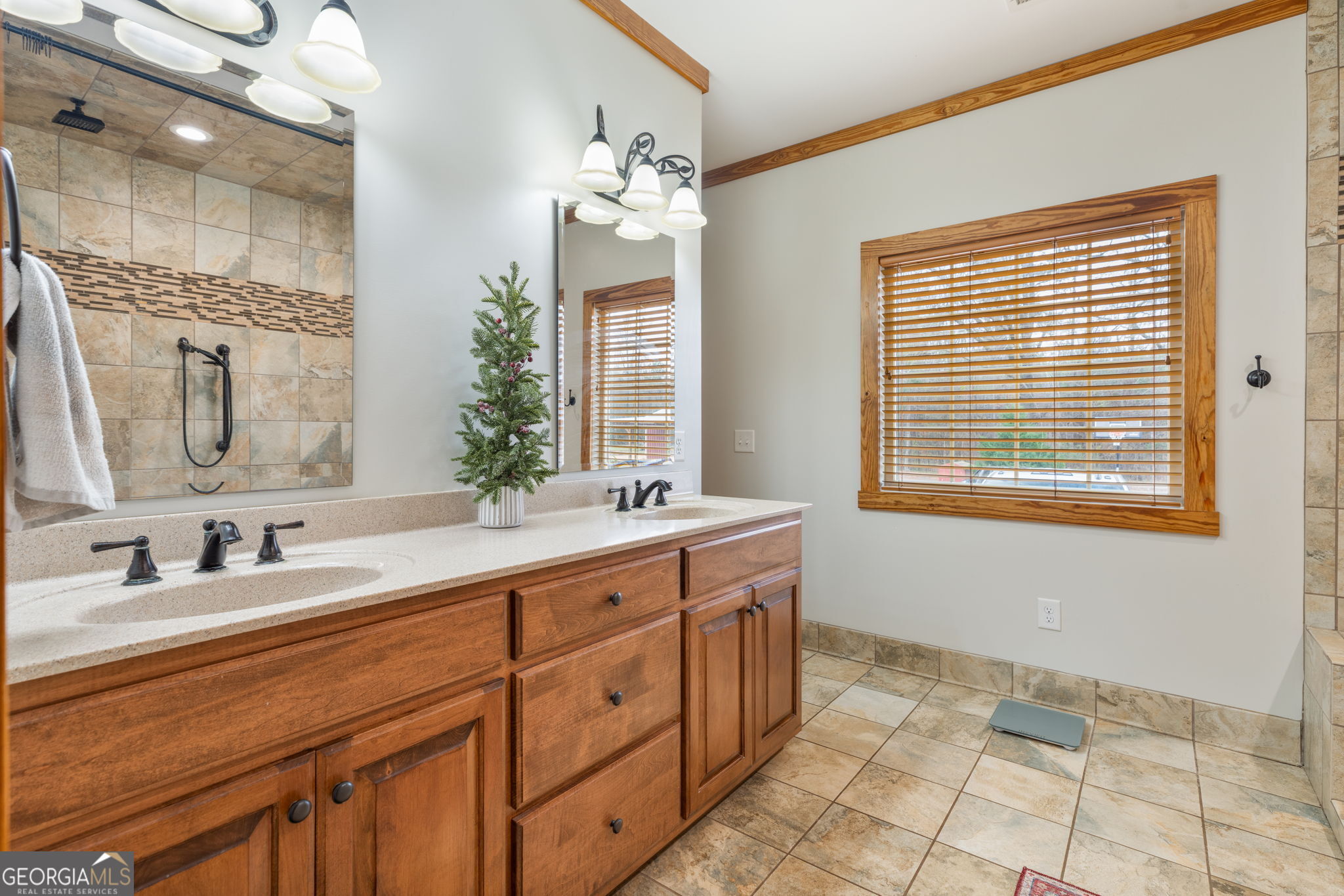 2770 Jones Road Sandersville, GA 31082 - Photo 35 of 80 a spacious bathroom with double sink a mirror and a shower
