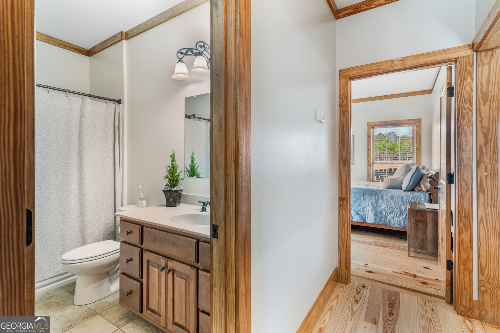 2770 Jones Road Sandersville, GA 31082 - Photo 42 of 80 a bathroom with a granite countertop sink and a mirror