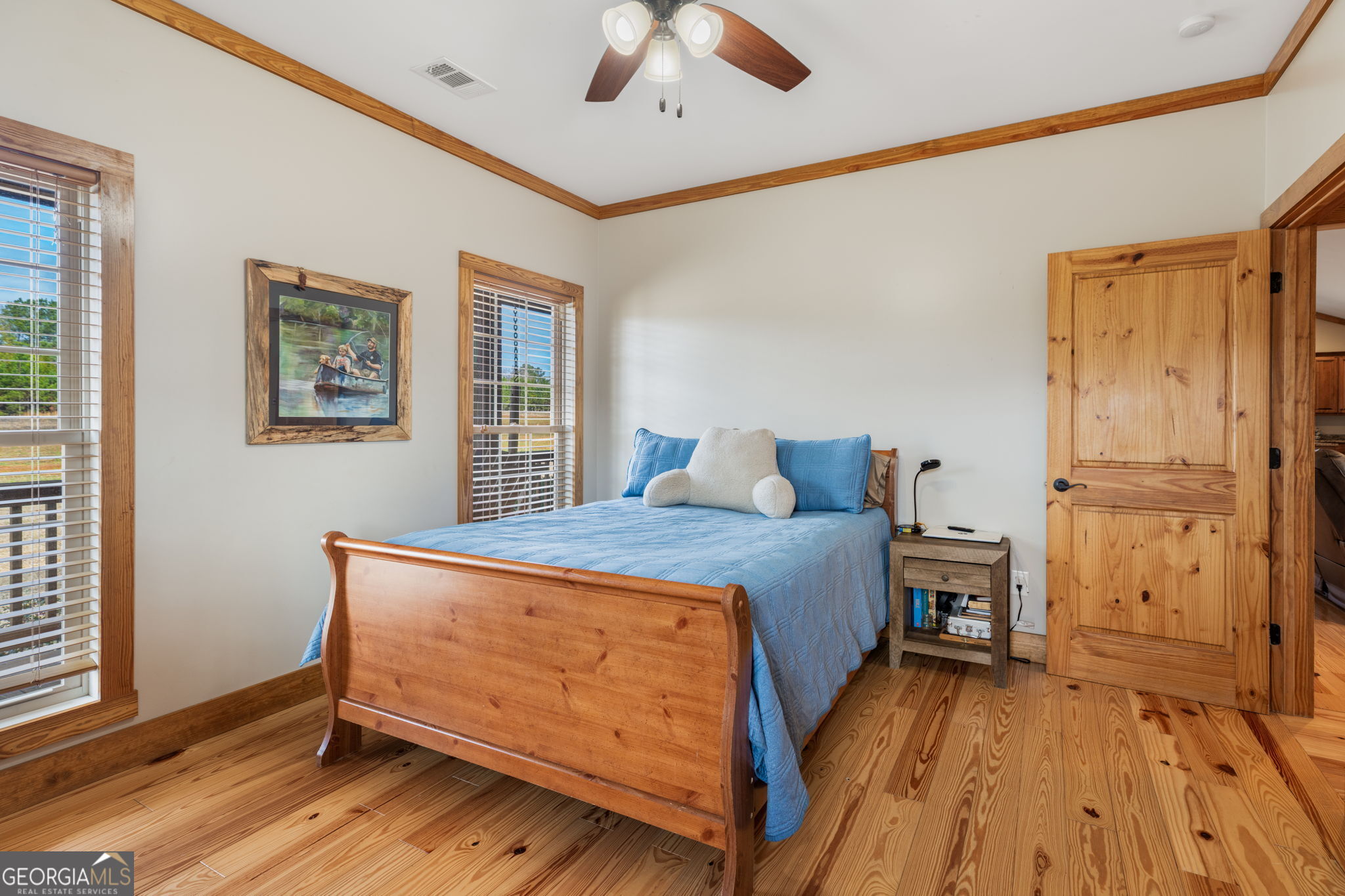 2770 Jones Road Sandersville, GA 31082 - Photo 45 of 80 a bedroom with a bed and wooden floor