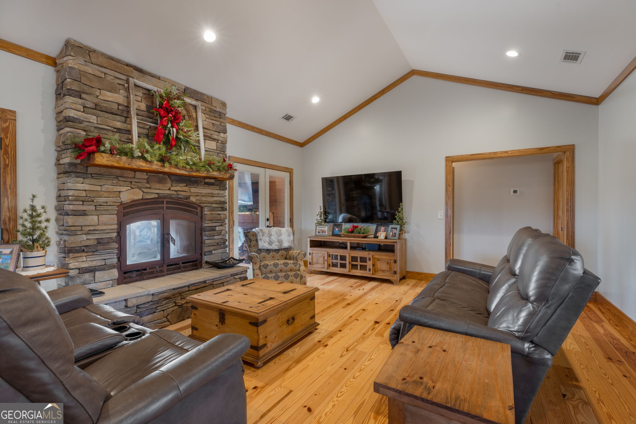 2770 Jones Road Sandersville, GA 31082 - Photo 10 of 80 a living room with furniture or flat screen tv and a fireplace
