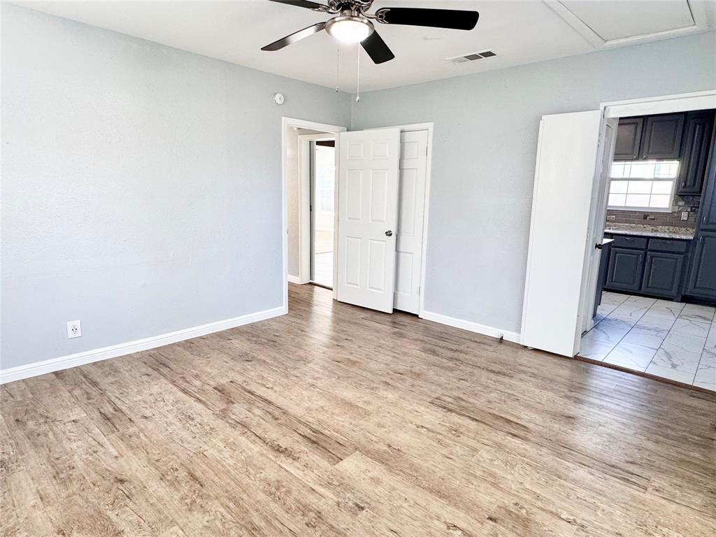 202 North Riverside Drive Fort Worth, TX 76111 - Photo 13 of 25 wooden floor in an empty room
