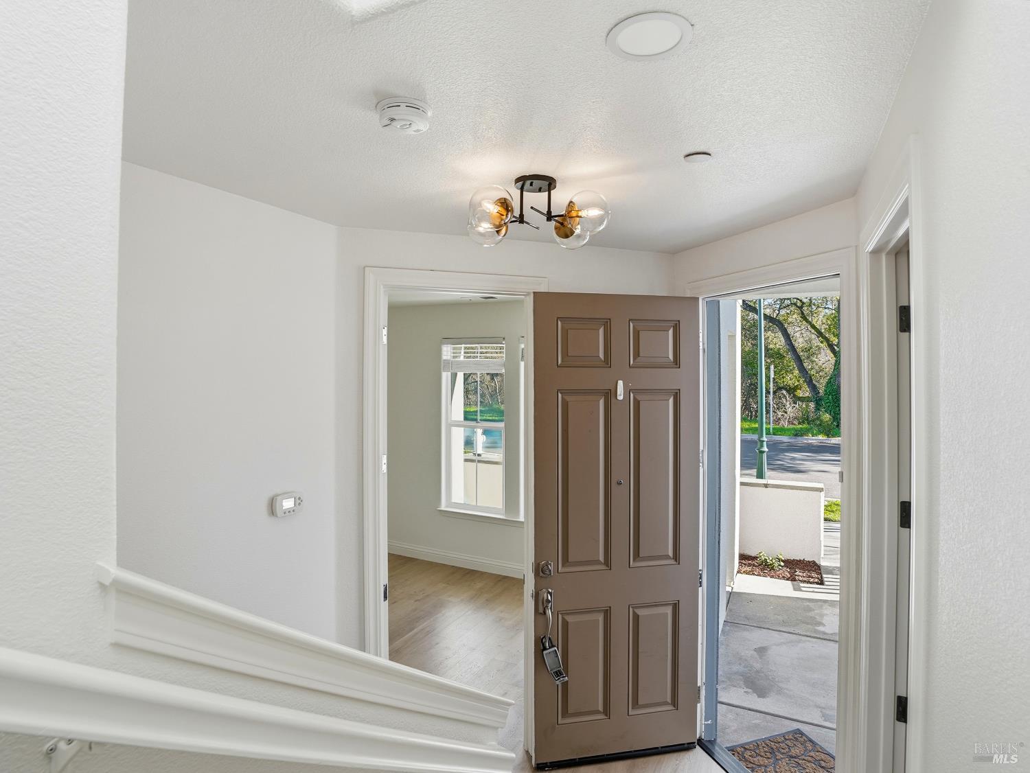 4424 Streamside Drive Santa Rosa, CA 95409 - Photo 6 of 55 a view of hallway with wooden floor and front door