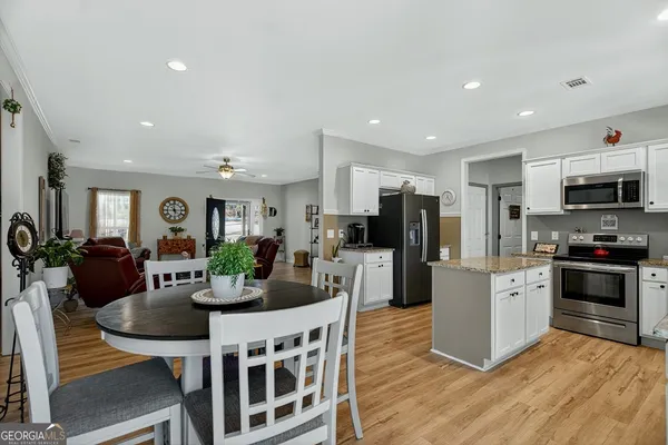 a work room with furniture and wooden floor