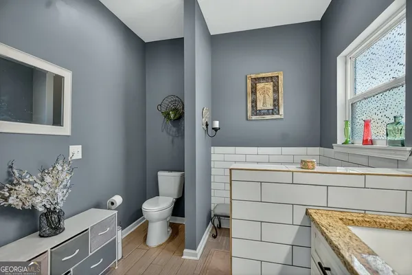 a bathroom with a sink and a large mirror