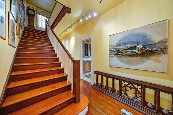 a bedroom with a large bed and a fireplace