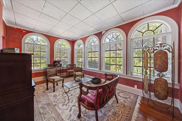 a view of a dining room with furniture and chandelier