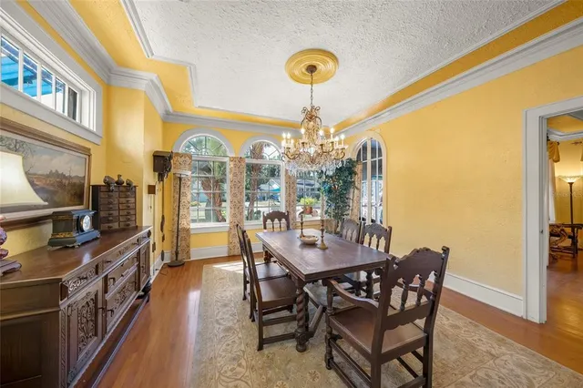 a living room with furniture fireplace and a large window