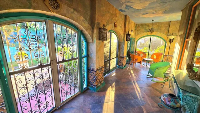 a large kitchen with stainless steel appliances granite countertop a stove a sink and a dishwasher next to a large window