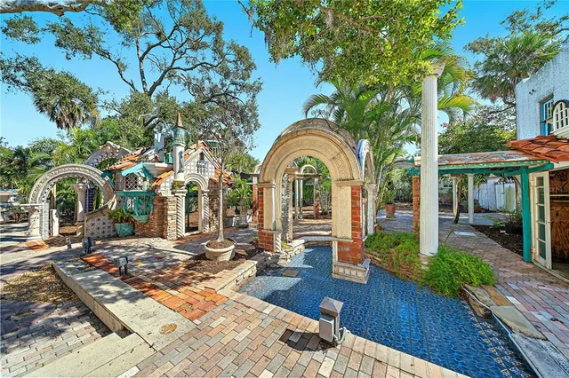 a view of a lake with houses in the back