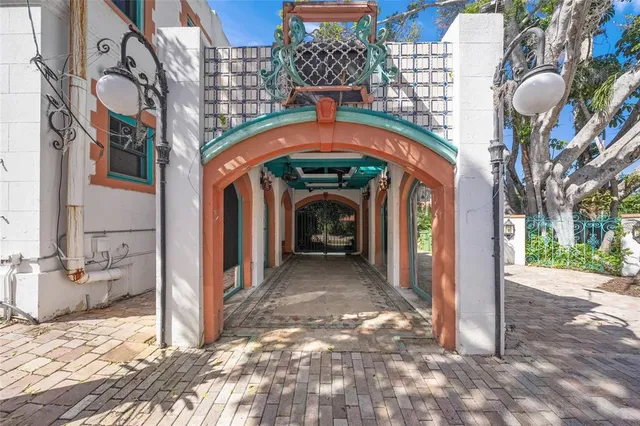 a view of an empty room with window and fire place