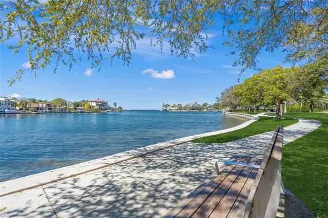 a bathroom with a bathtub shower sink vanity and toilet