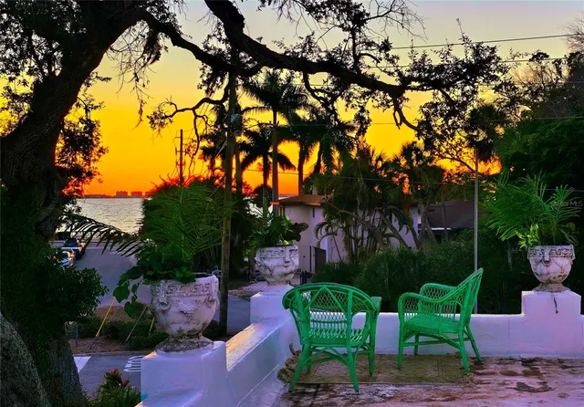 a living room with fireplace furniture and a chandelier