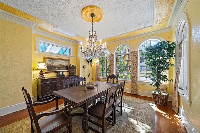 a living room with lots of furniture and a chandelier