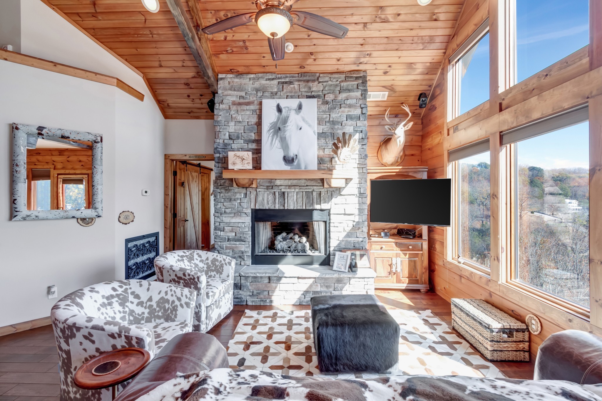 5320 Coconut Ridge Road Smithville, TN 37166 - Photo 24 of 52 a living room with furniture a fireplace and a flat screen tv
