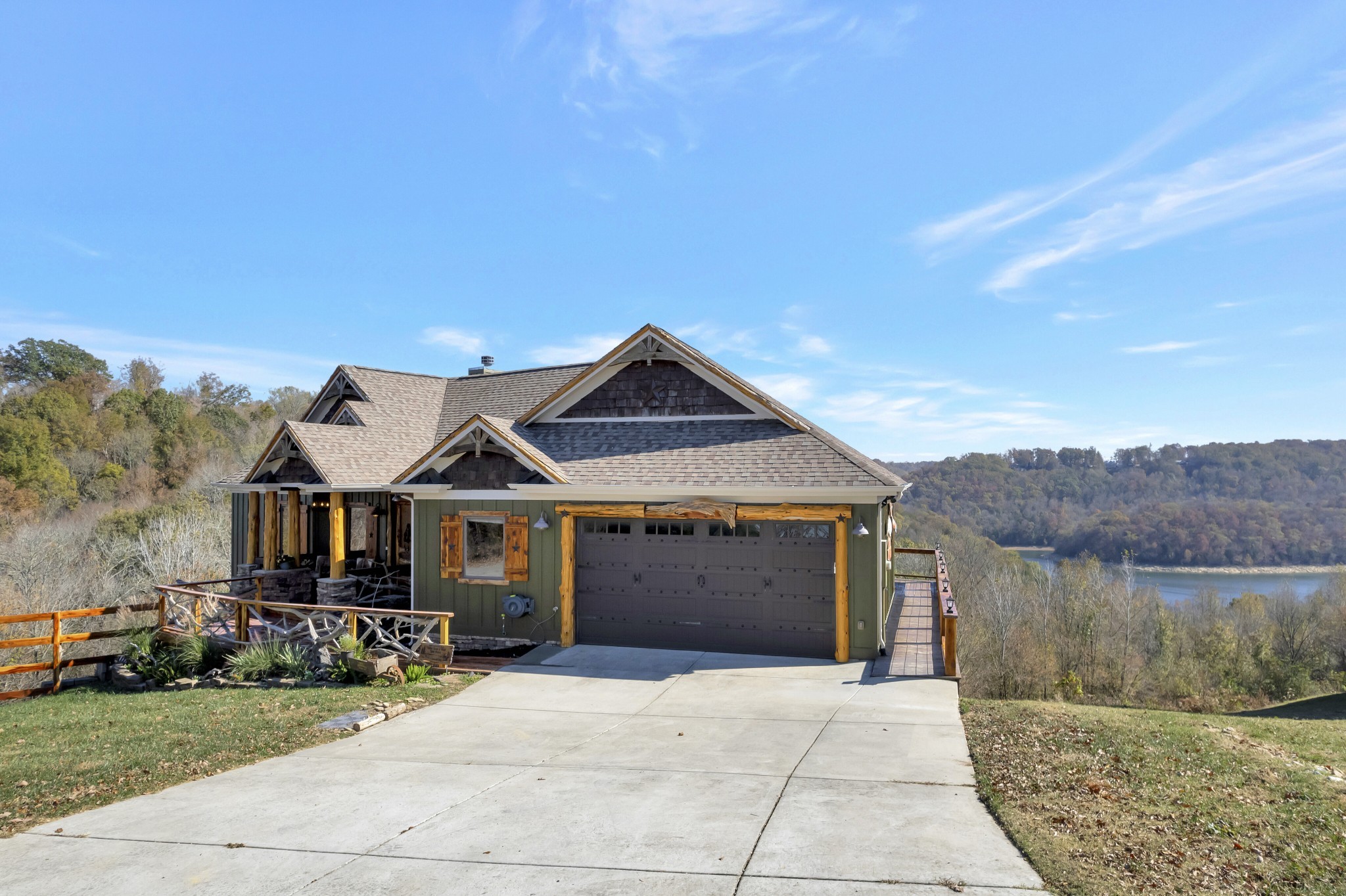 5320 Coconut Ridge Road Smithville, TN 37166 - Photo 3 of 52 a front view of a house with a yard and garage