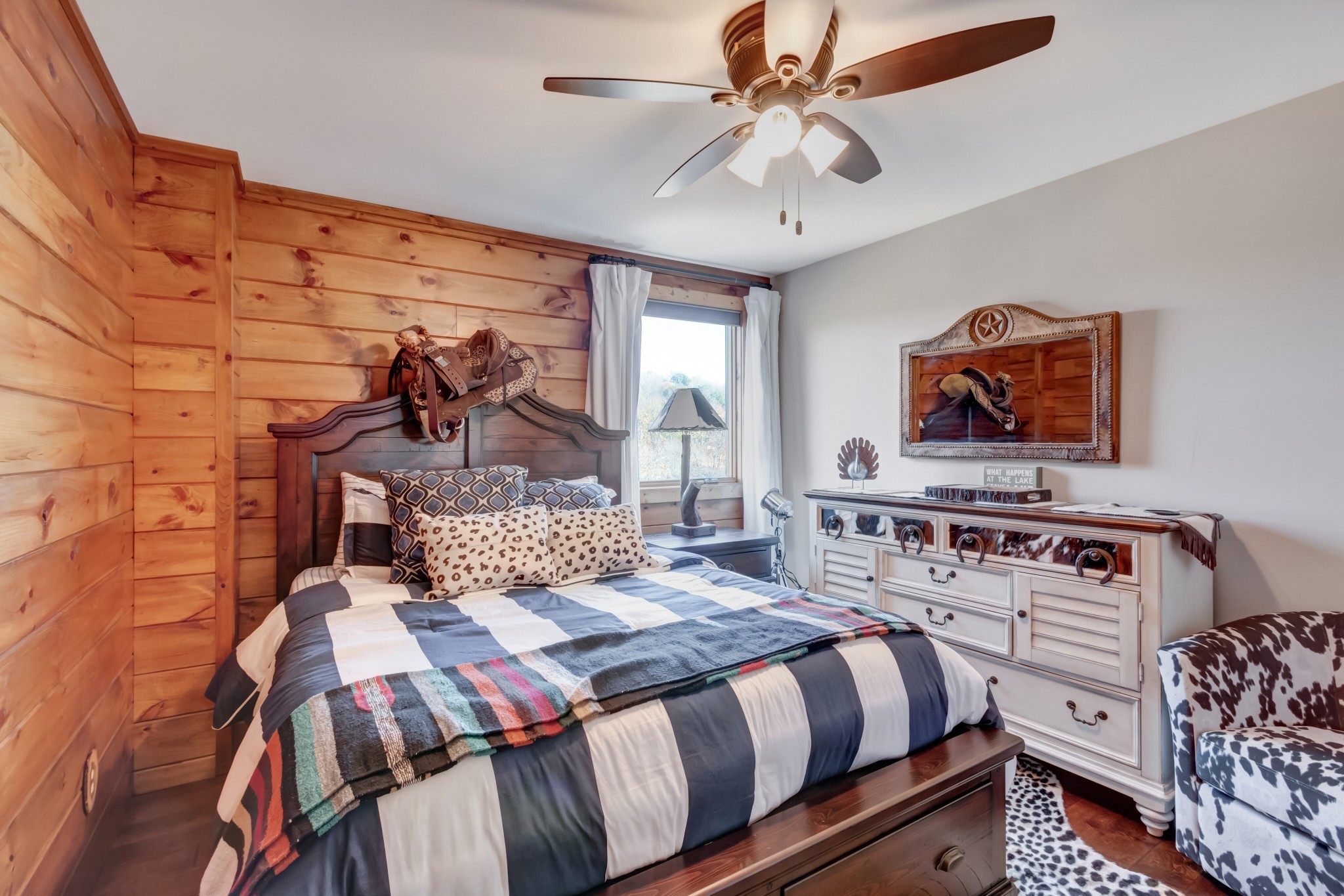 5320 Coconut Ridge Road Smithville, TN 37166 - Photo 38 of 52 a bedroom with a bed a dresser and potted plants