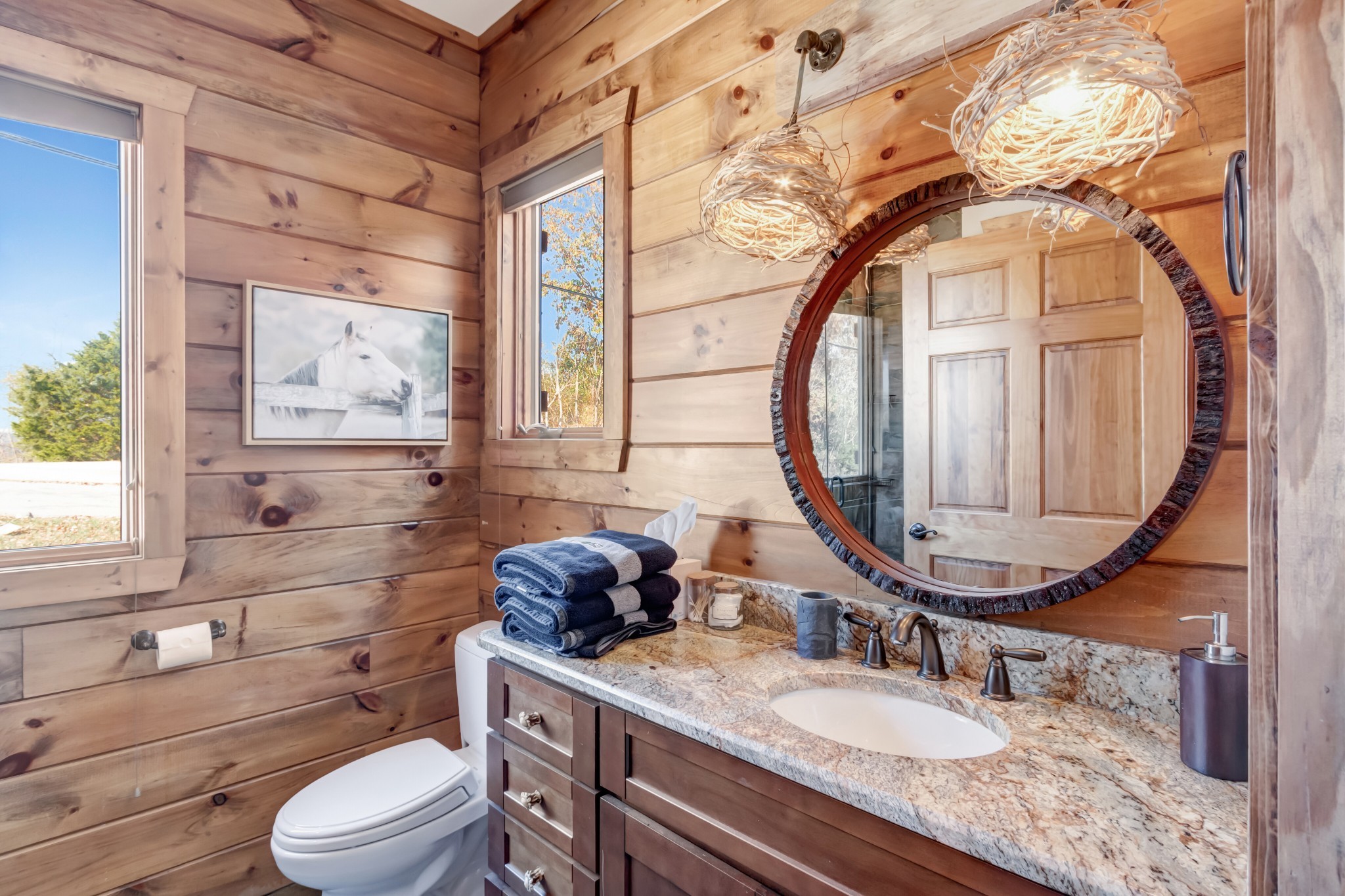 5320 Coconut Ridge Road Smithville, TN 37166 - Photo 40 of 52 a bathroom with a granite countertop sink mirror vanity and toilet