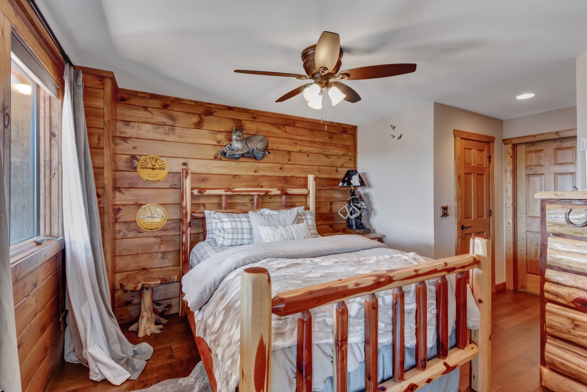 5320 Coconut Ridge Road Smithville, TN 37166 - Photo 45 of 52 a bedroom with a bed and a chandelier