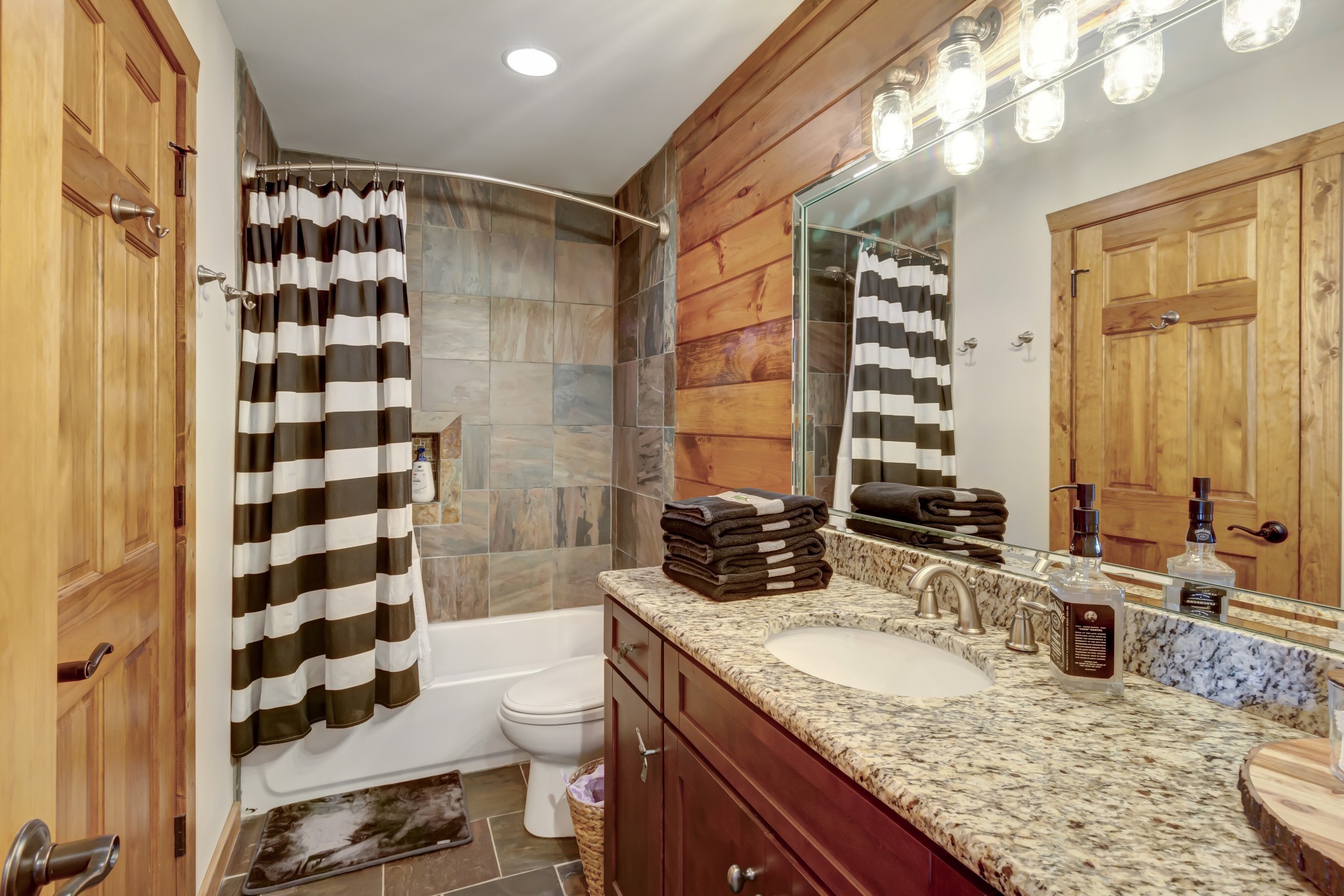 5320 Coconut Ridge Road Smithville, TN 37166 - Photo 47 of 52 a bathroom with a granite countertop sink and a mirror
