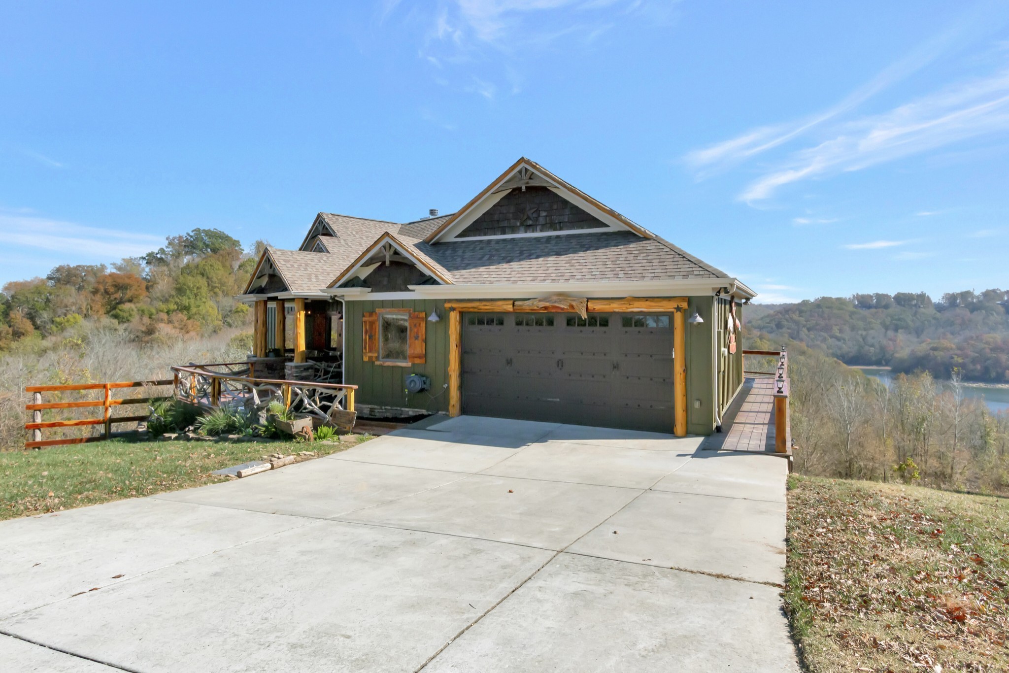 5320 Coconut Ridge Road Smithville, TN 37166 - Photo 5 of 52 a front view of a house with a yard and garage