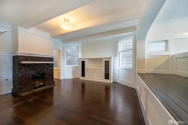 wooden floor in a hall with an empty room