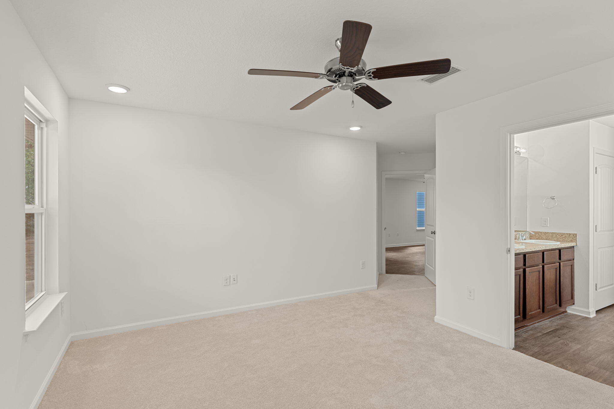 545 Earl Godwin Road Freeport, FL 32439 - Photo 19 of 50 a view of a livingroom with a ceiling fan and a window