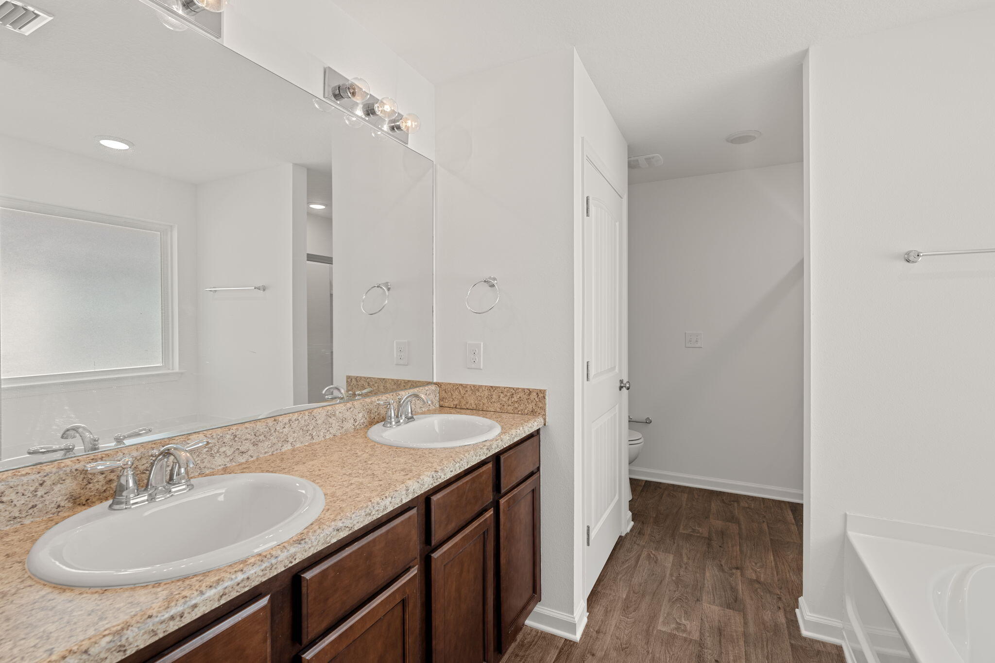 545 Earl Godwin Road Freeport, FL 32439 - Photo 20 of 50 a bathroom with a granite countertop sink a mirror and a