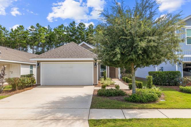 545 Earl Godwin Road Freeport, FL 32439 - Photo 2 of 50 a front view of a house with a yard and garage