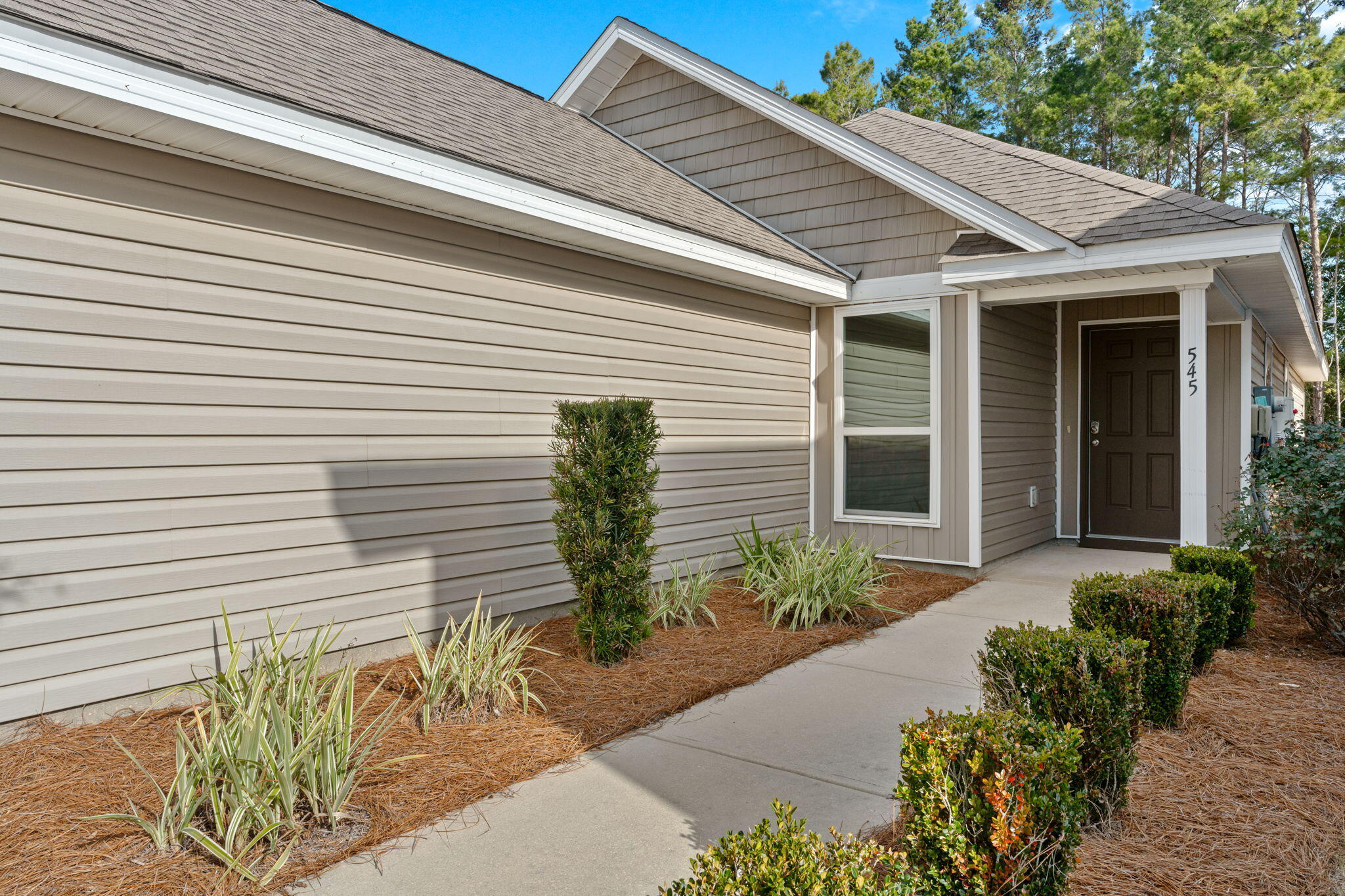545 Earl Godwin Road Freeport, FL 32439 - Photo 3 of 50 a front view of a house with garden
