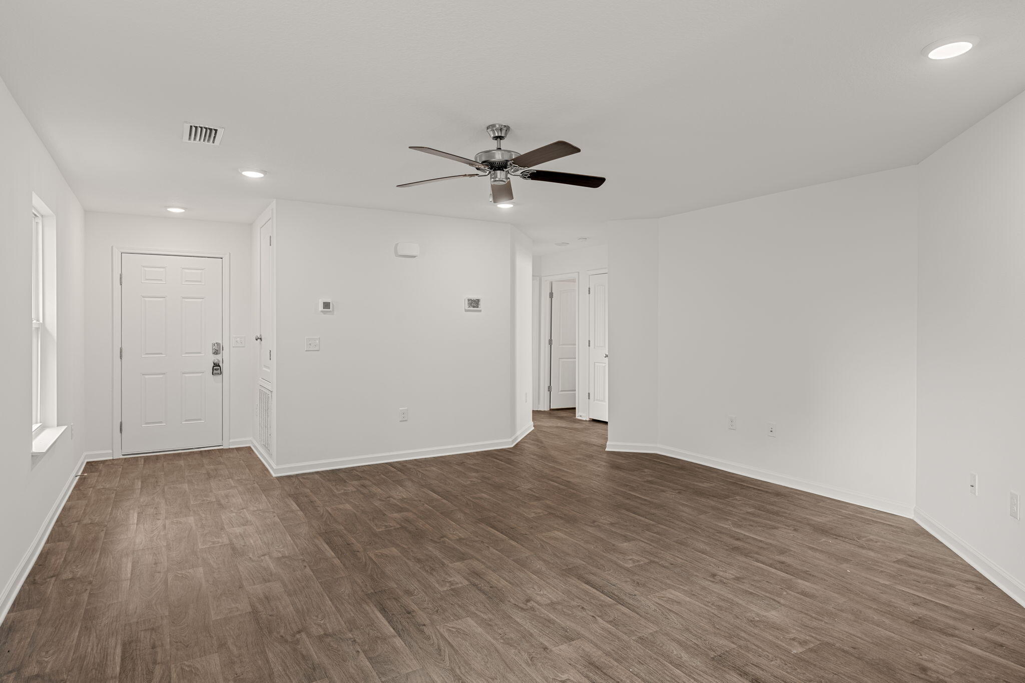 545 Earl Godwin Road Freeport, FL 32439 - Photo 7 of 50 wooden floor in an empty room