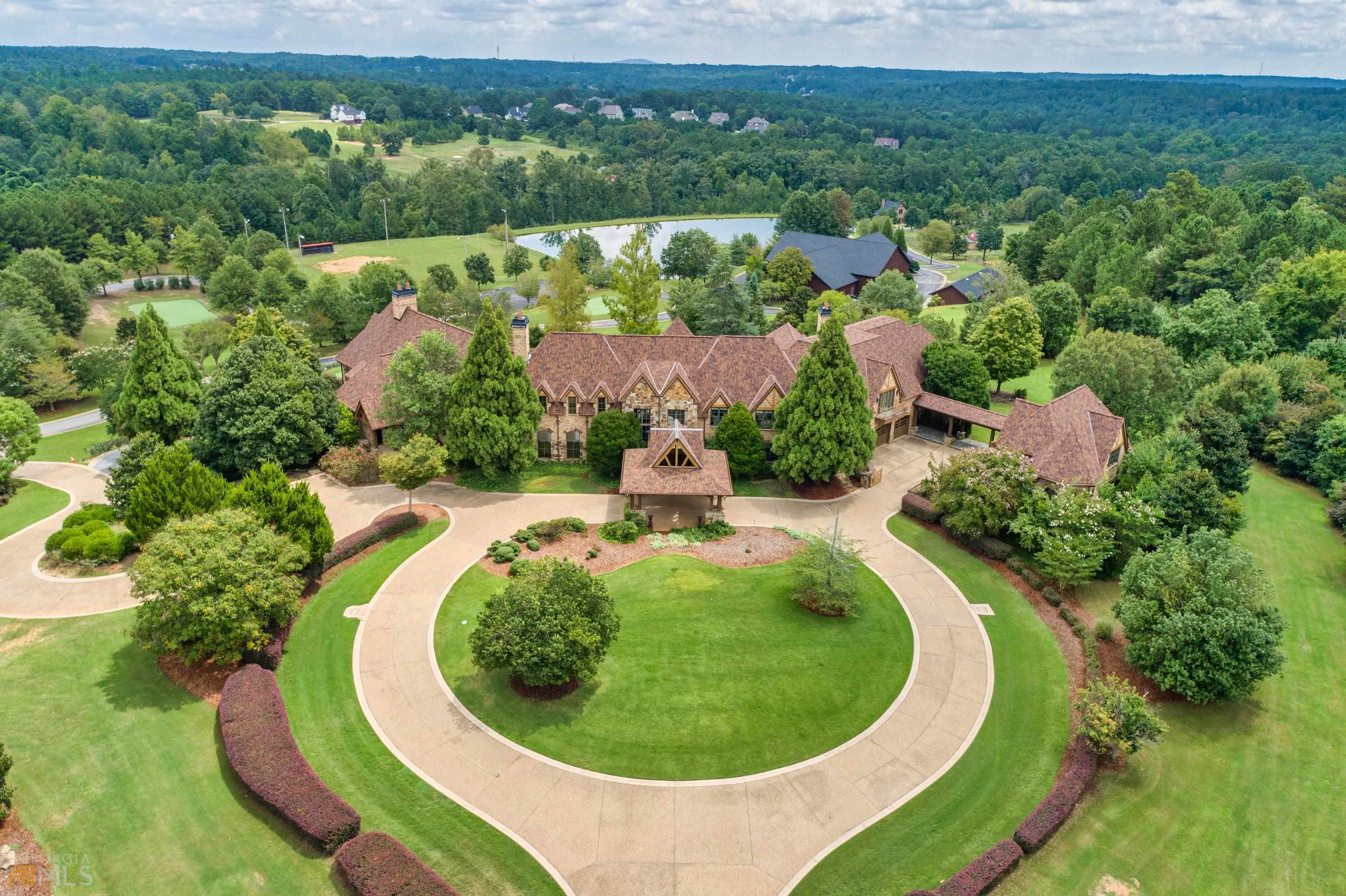 an aerial view of a house with outdoor space and street view